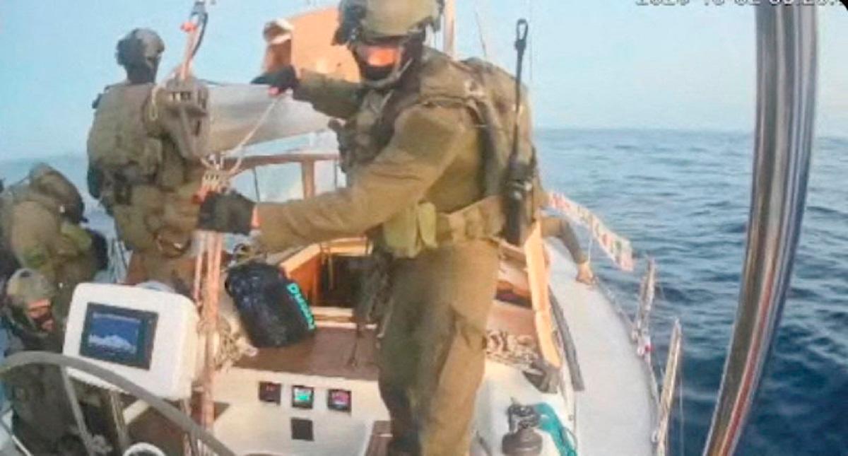 A screengrab from a live stream video shows people in uniform aboard the Gaza-bound vessel Oxygono, part of the Global Sumud Flotilla, which flotilla organisers report has been intercepted, October 2, 2025. - Global Sumud Flotilla/Handout via REUTERS