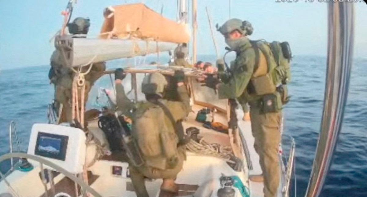 A screengrab from a live stream video shows people in uniform aboard the Gaza-bound vessel Oxygono, part of the Global Sumud Flotilla, which flotilla organisers report has been intercepted, October 2, 2025. - Global Sumud Flotilla/Handout via REUTERS