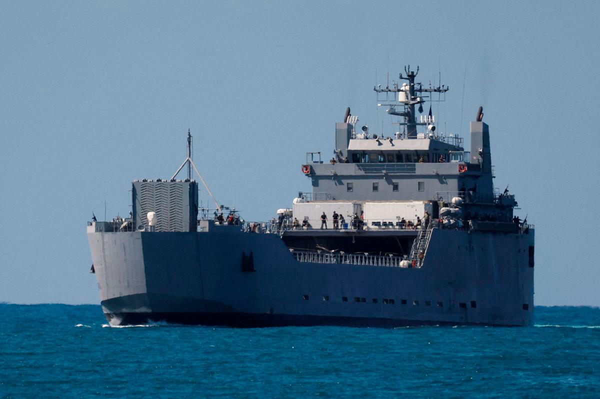 An Israeli navy vessel approaches Ashdod Port, carrying people detained by Israel from the Global Sumud Flotilla trying to deliver aid to Gaza, in southern Israel, October 2, 2025. REUTERS/Ammar Awad