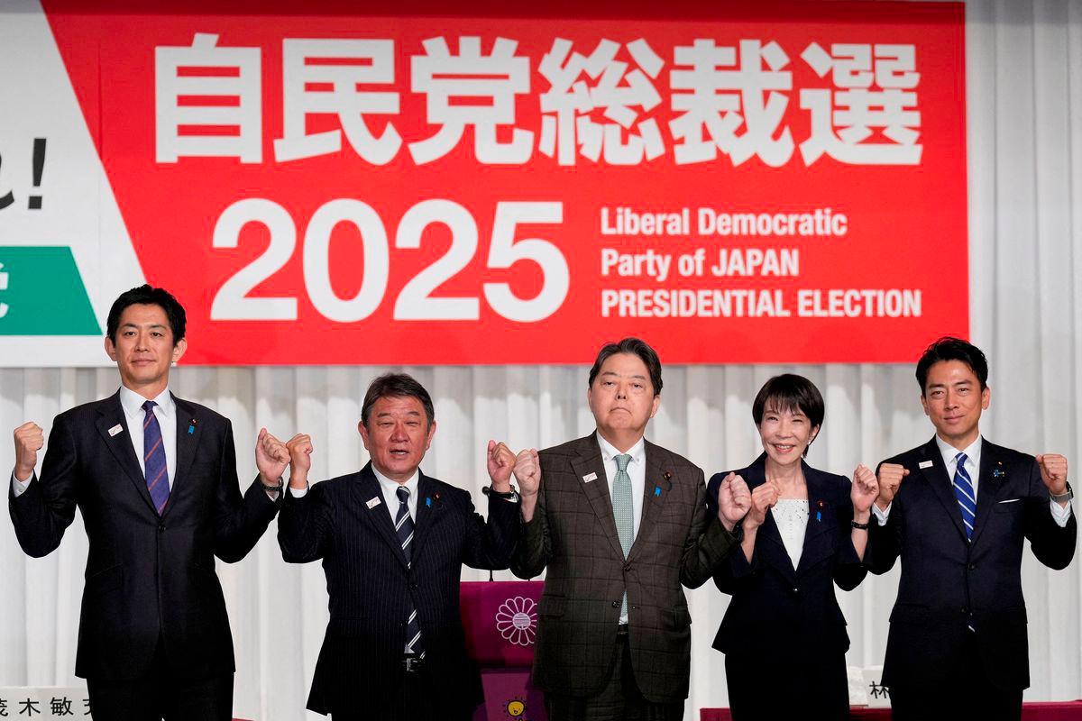 Japan's former Economic Security Minister Takayuki Kobayashi, former Foreign Minister Toshimitsu Motegi, Chief Cabinet Secretary Yoshimasa Hayashi, former Economic Security Minister Sanae Takaichi and Agriculture Minister Shinjiro Koizumi pose at the Liberal Democratic Party (LDP) presidential election candidates joint press conference at LDP headquarters, in Tokyo, Japan September 23, 2025. - Eugene Hoshiko/Pool via REUTERSPIX