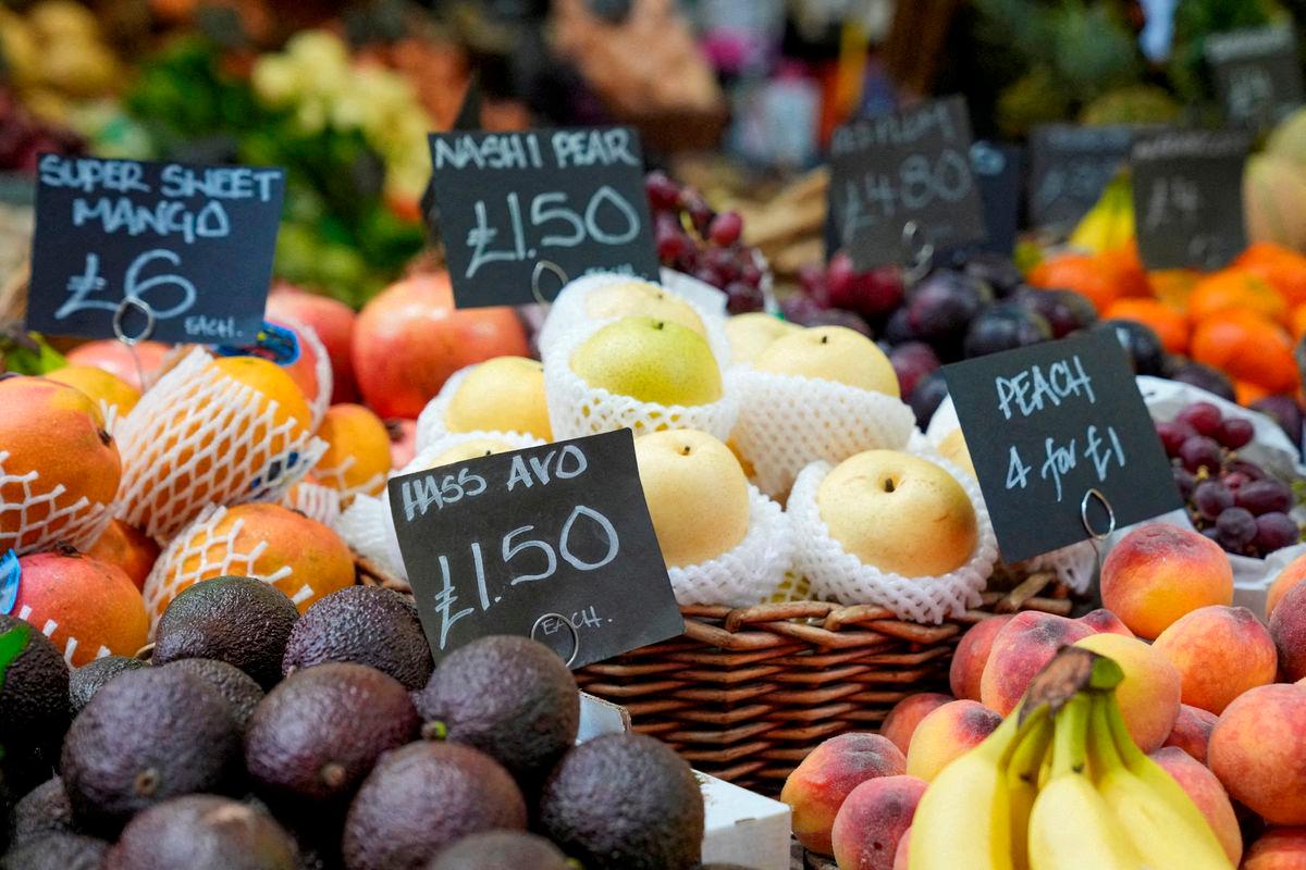 FILE PHOTO: Prices of food are displayed at the Borough Market as the UK inflation rates fall by less than expected in London, Britain May 22, 2024. REUTERS/Maja Smiejkowska/File Photo