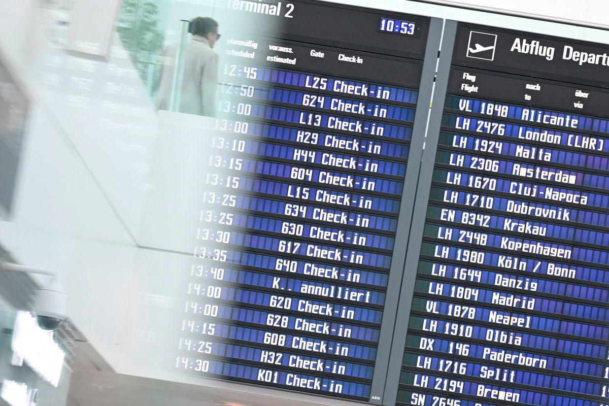 The display board at the airport in Munich, Germany, October 3, 2025. REUTERS/Angelika Warmuth