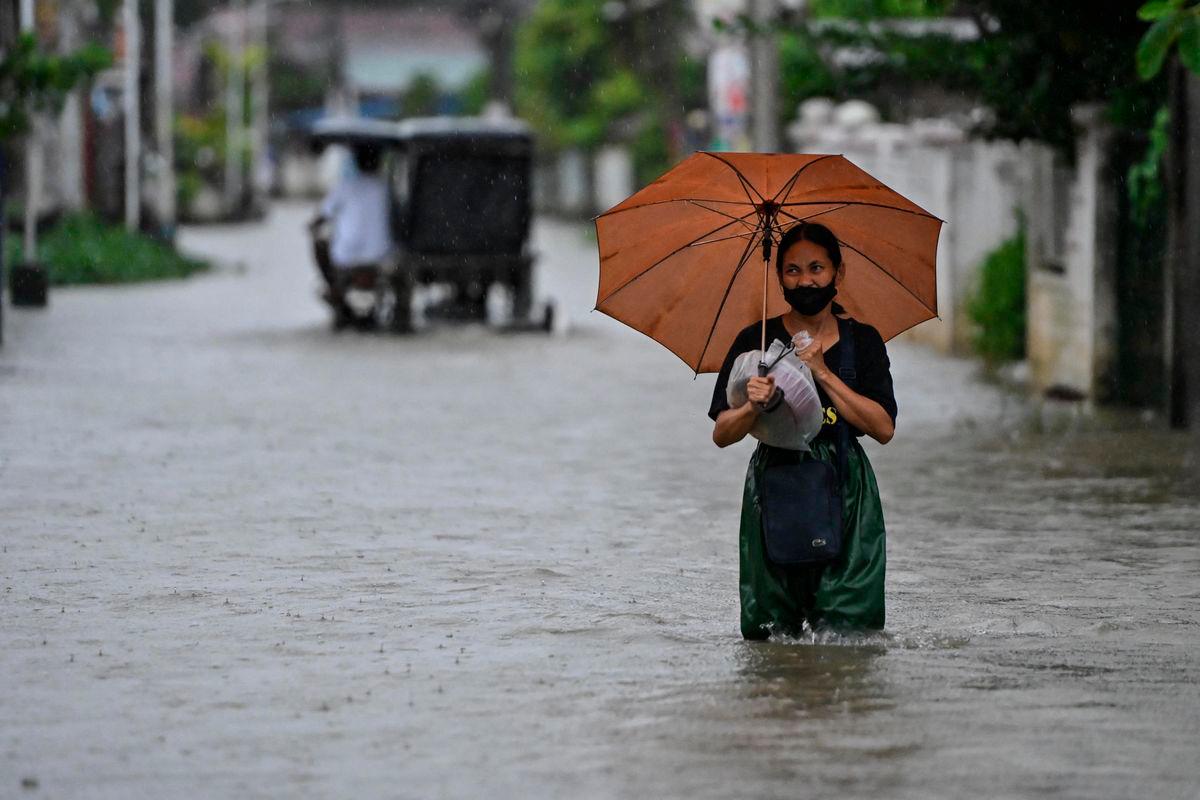 For representational purposes only: A woman wades through a flooded street following rain, intensified by Severe Tropical Storm Matmo, in Santa Lucia, Calumpit, Bulacan province, Philippines, October 3, 2025. REUTERS/Noel Celis