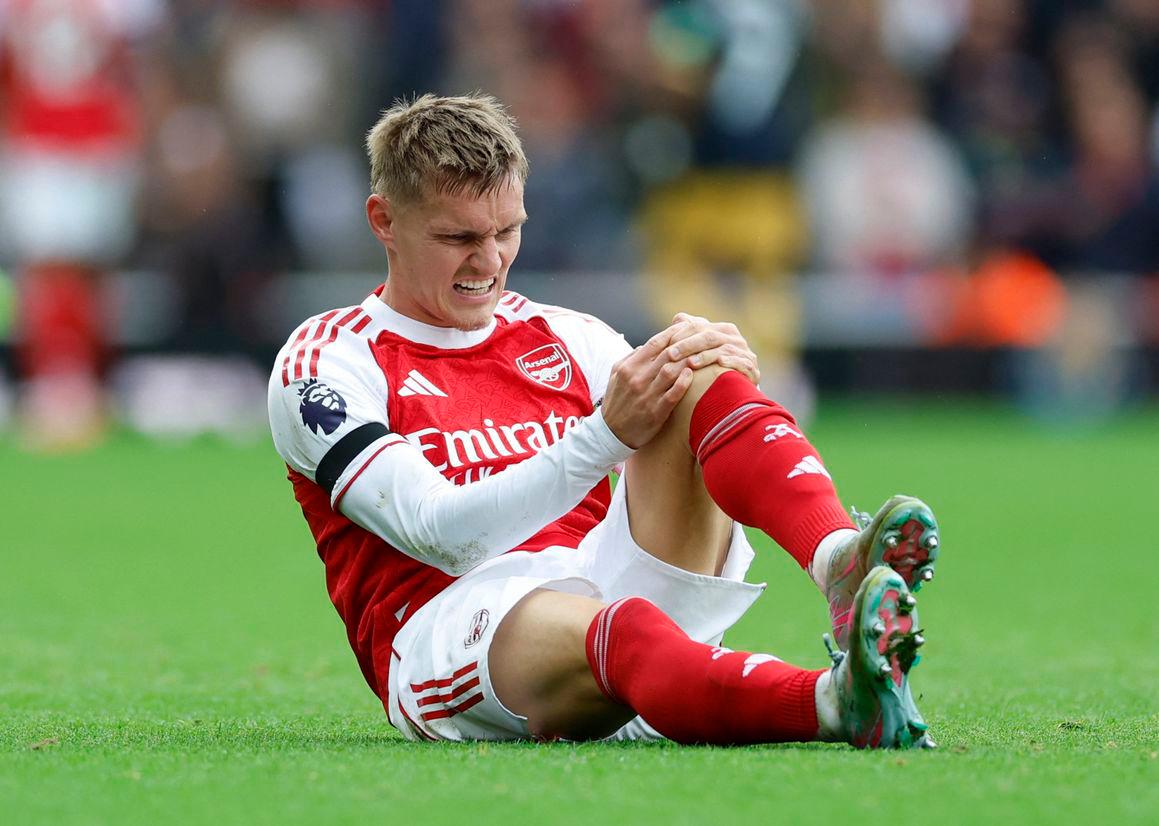 Martin Odegaard reacts after sustaining an injury Action Images via Reuters/Peter Cziborra
