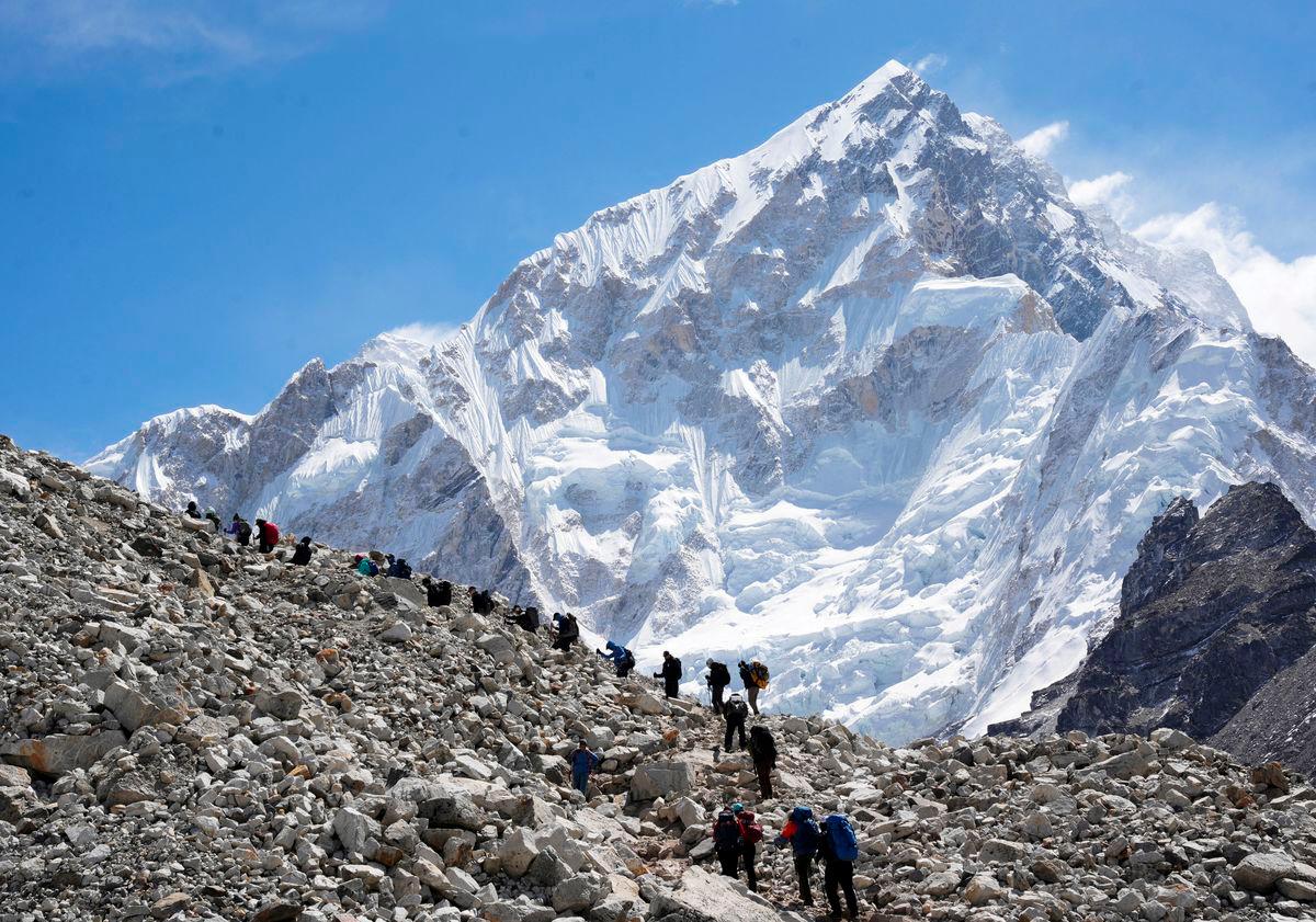 FILE PHOTO: Mountaineers and trekkers head towards the Everest base camp from Lobuche in the Solukhumbu district, also known as the Everest region, Nepal April 12, 2025. REUTERS/Purnima Shrestha/File Photo
