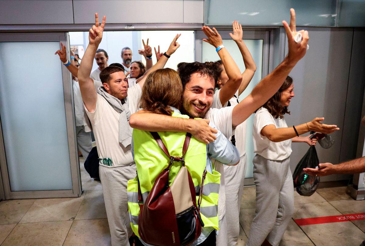 Some of the Spanish activists and politicians who were part of the Global Sumud Flotilla and were detained by Israeli forces, celebrate upon arrival at Adolfo Suarez Madrid-Barajas Airport in Madrid, Spain, October 5, 2025. REUTERS/Juan Medina