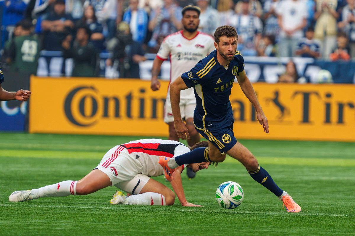 Vancouver Whitecaps FC midfielder Thomas Muller (13) dribbles the ball in the first half against the San Jose Earthquakes in the first half at BC Place. - Christopher Morris-Imagn Images