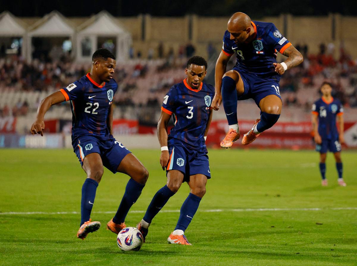 Netherlands’ Denzel Dumfries, Jurrien Timber and Donyell Malen in action REUTERS/Darrin Zammit Lupi
