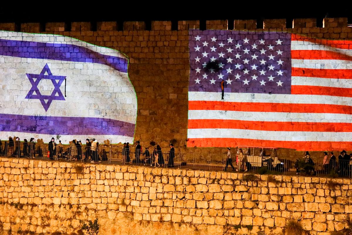 United States and Israel flags are projected on the walls of the Old city of Jerusalem in celebration after Israel and Hamas agreed to the first phase of U.S. President Donald Trump’s plan to end the war in Gaza, October 9, 2025. REUTERS/Sinan Abu Mayzer