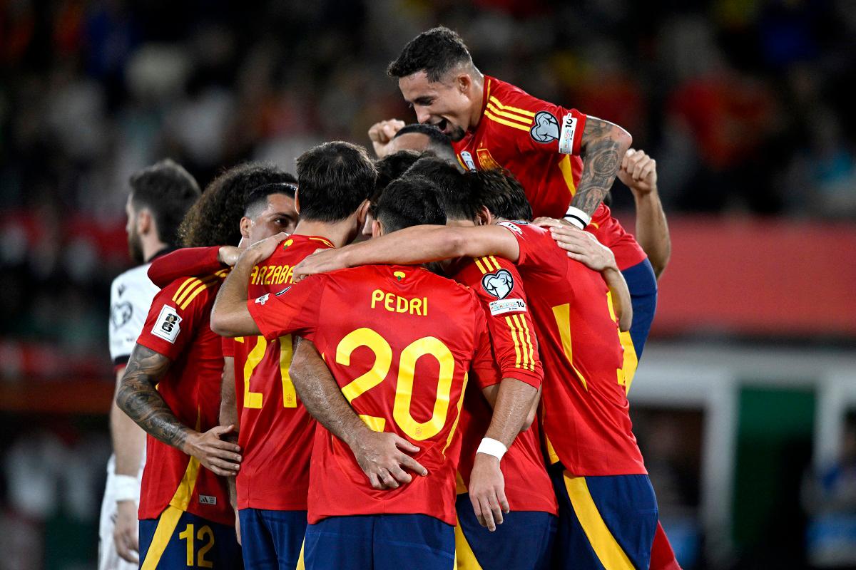 Spain’s Mikel Oyarzabal celebrates scoring their second goal with teammates. - REUTERS/Pablo Morano