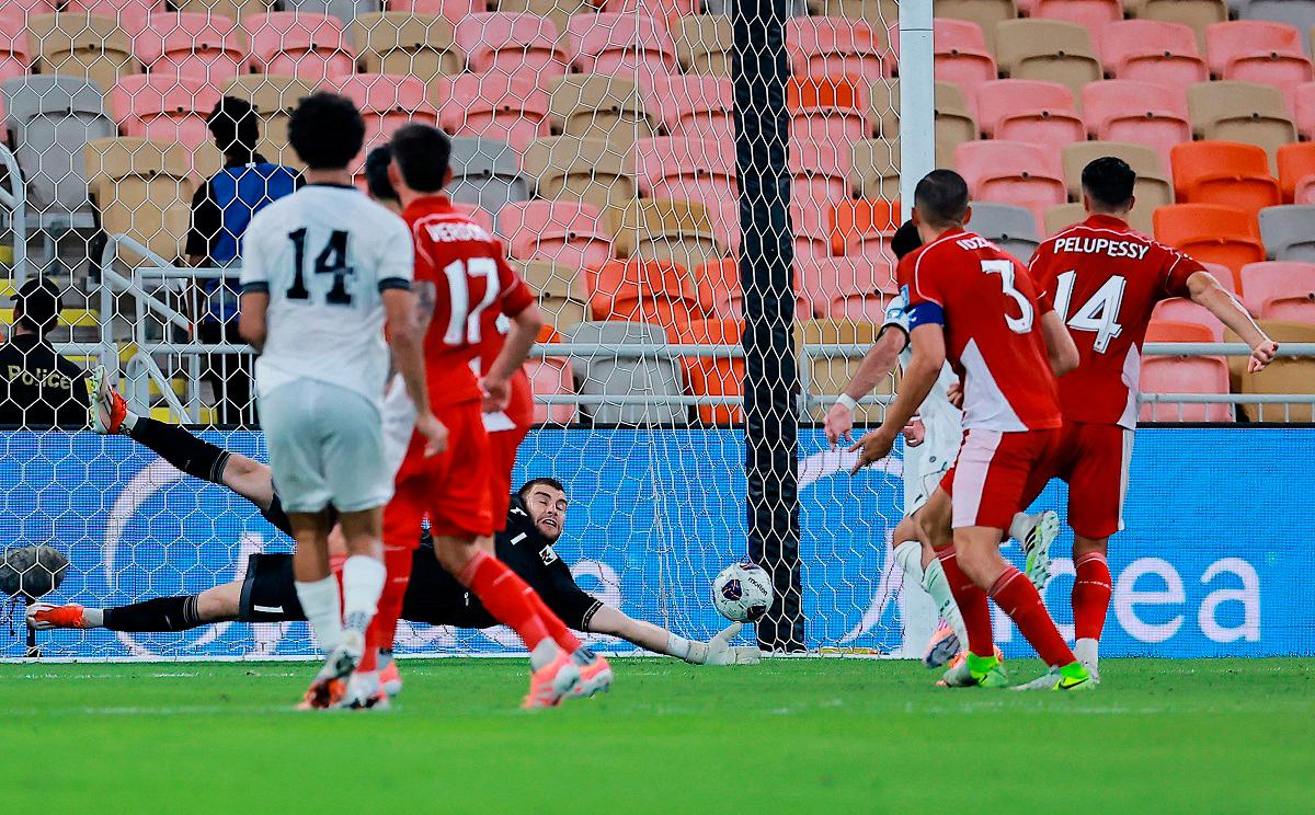 Iraq’s Zidane Iqbal scores their first goal. - REUTERS/Stringer
