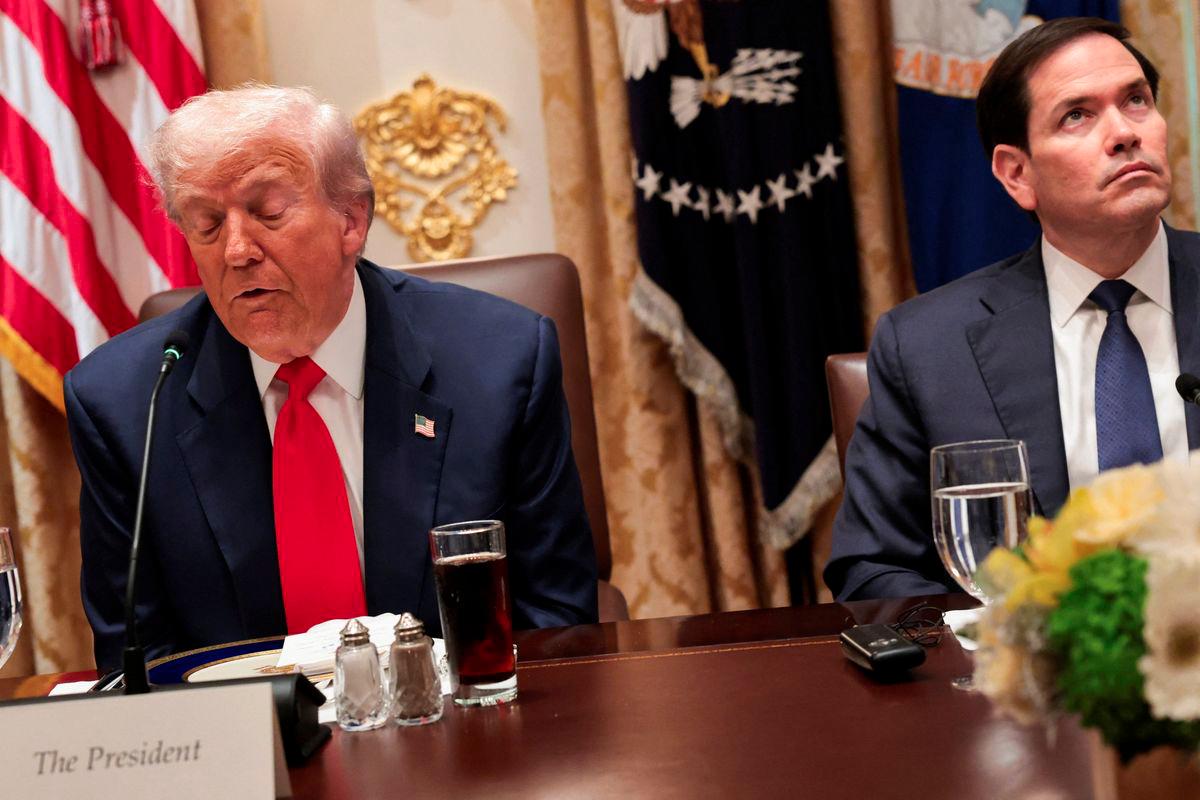 U.S. President Donald Trump, with Secretary of State Marco Rubio, makes remarks to reporters at a lunch with Argentina's President Javier Milei in the Cabinet Room at the White House in Washington, D.C., U.S., October 14, 2025. - REUTERSPIX