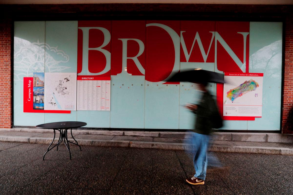 A person walks past a sign of the Brown University in Providence, Rhode Island, U.S., March 17, 2025. - REUTERSPIX