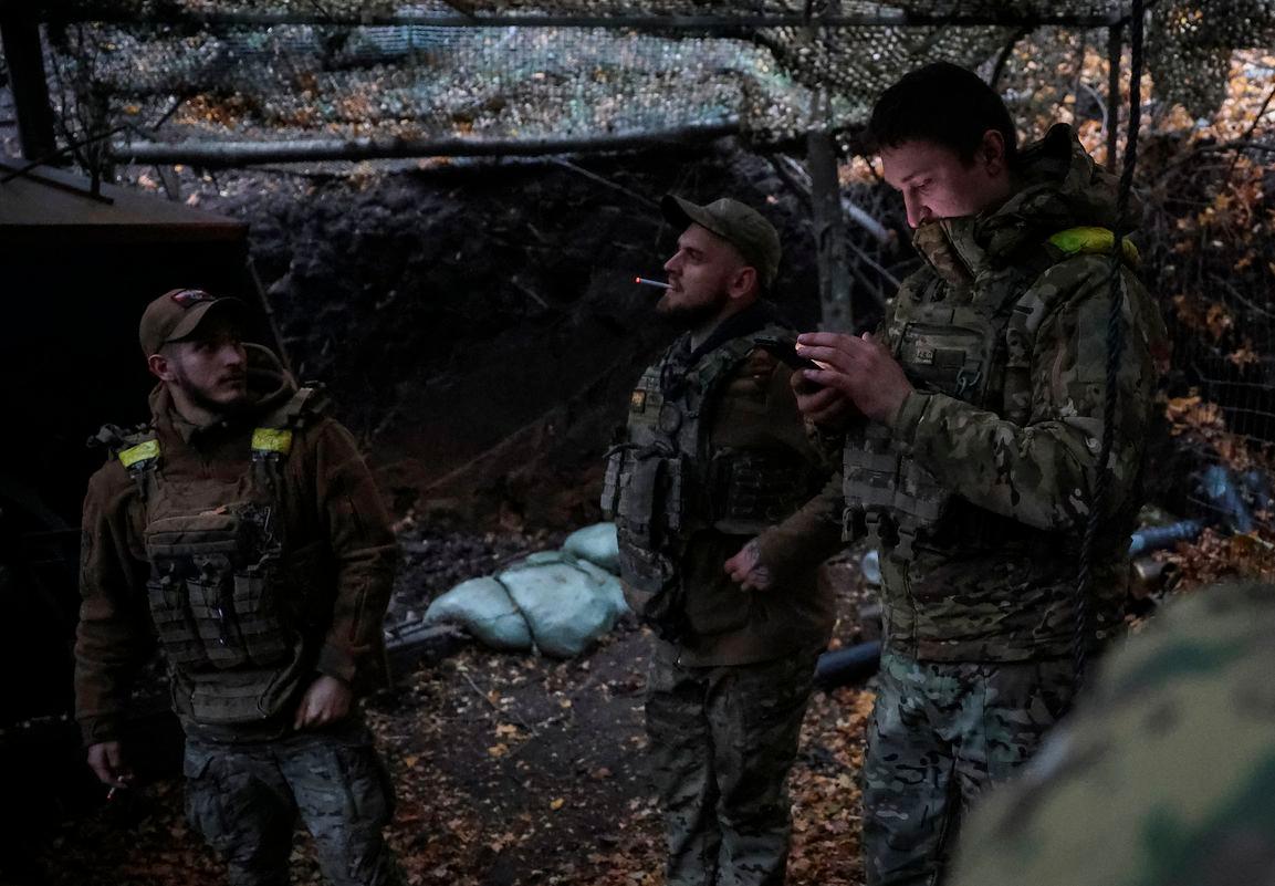 Artillerymen of the 15th 'Kara-Dag' Brigade of the Operational Assignment of the National Guard of Ukraine stand at a position, amid Russia's attack on Ukraine, near the frontline town of Kupiansk in Kharkiv region, Ukraine October 17, 2025. - REUTERSPIX