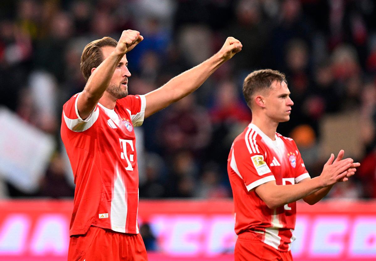 Bayern Munich’s Harry Kane and Joshua Kimmich celebrates after the match. - REUTERS/Angelika Warmuth