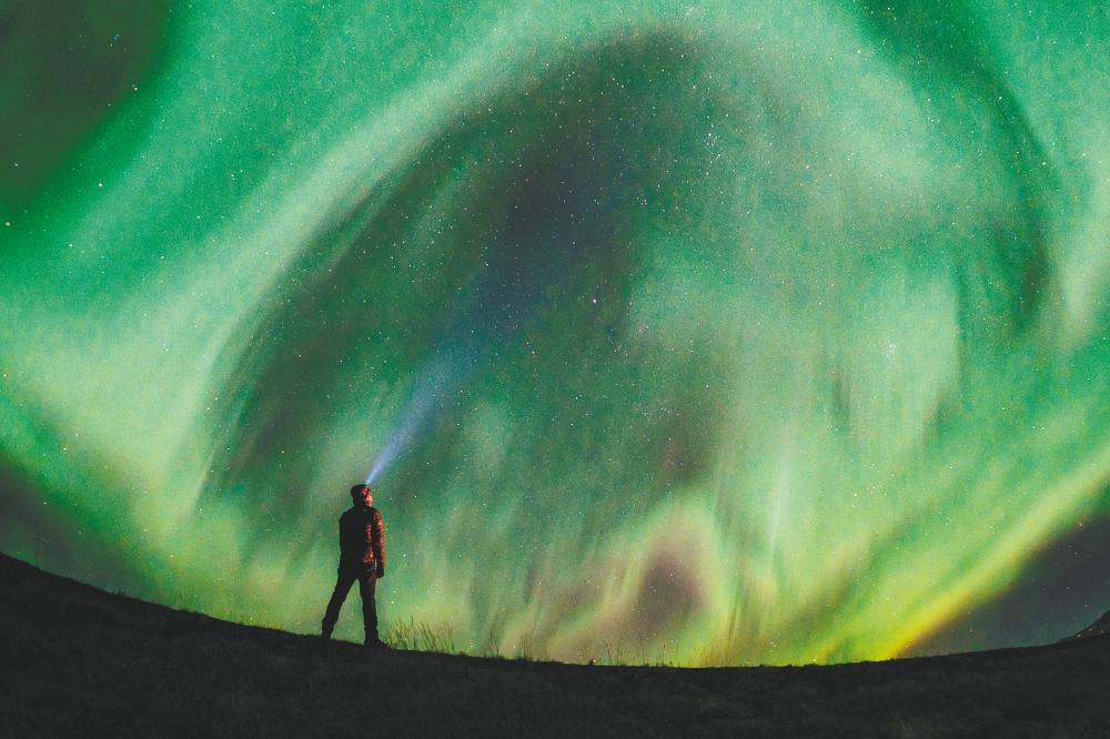 Fakrul’s self-portrait with the Aurora Borealis, during a geomagnetic storm. – Courtesy of Fakrul Jamil