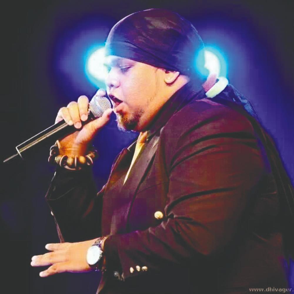 (far left) Varmendira Sasthiri Krishnan rapping on stage as MC Bullet. – Picture courtesy of Varmendira Sasthiri Krishnan