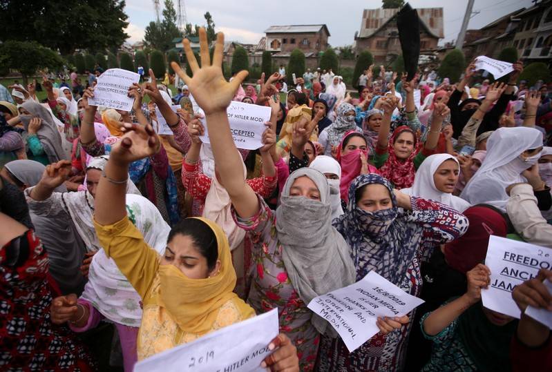 Kashmiri women shout slogans at a protest after Friday prayers during restrictions after the Indian government scrapped the special constitutional status for Kashmir, in Srinagar Aug 16. — Reuters
