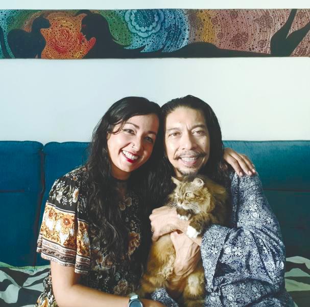 Anna with her husband and cat, her biggest motivators.