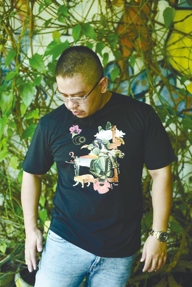 Nizal Mokhtar wearing a t-shirt highlighting the flora and fauna of Malaysia.
