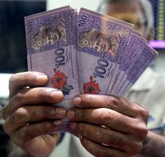 Ringgit opens stronger vs greenback as fed leaves rates unchanged
