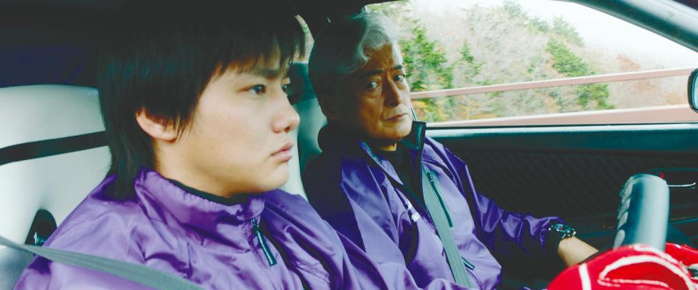 Shuhei Nomura (left) plays Esports gamer Koichi Oba, and Takanori Jinnai plays veteran drift racing mentor Ryousuke Muto.