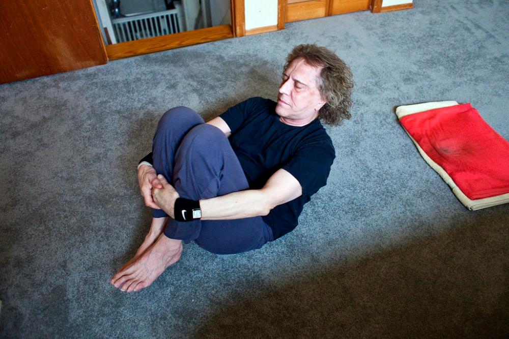 Mick Rock practicing Kundalini yoga in his home in Livingston, Staten Island. -Credit: Bryan Anselm for The New York Times