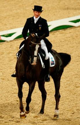 FILE PHOTO: Heath Ryan of Australia riding Greenoaks Dundee during the Equestrian Dressage Grand Prix competition at the Beijing 2008 Olympic Games in Hong Kong August 13, 2008. REUTERSpix