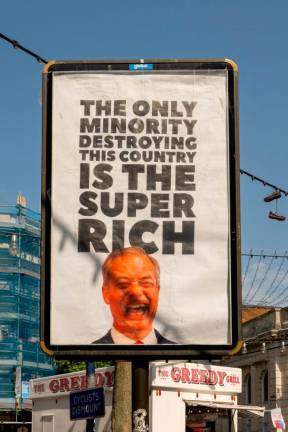 A view shows a billboard with an image of Reform party leader Nigel Farage, in Ramsgate, Britain, May 2, 2025. Everyone Hates Elon/Handout via REUTERSpix