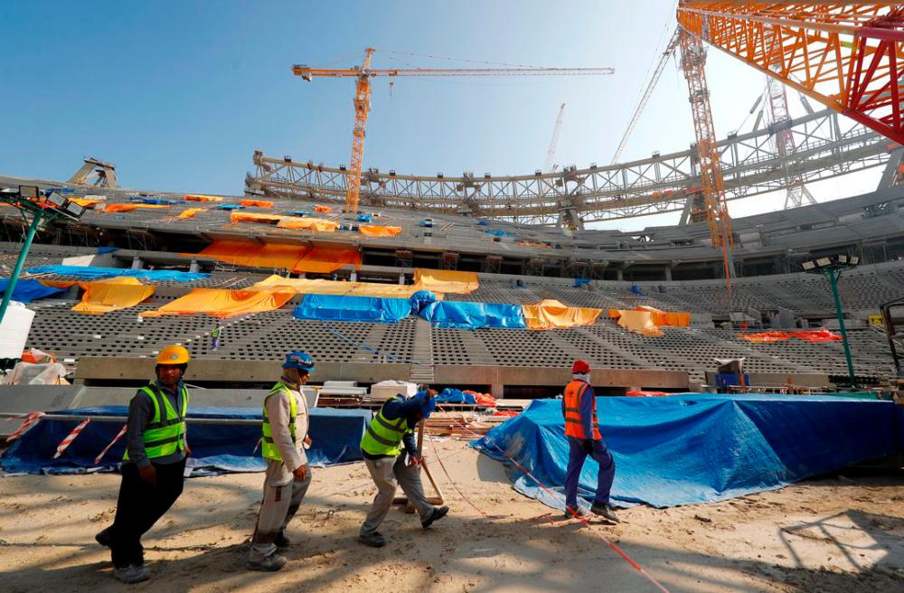 Workers are seen inside the Lusail stadium which is under construction for the upcoming 2022 Fifa soccer World Cup during a stadium tour in Doha, Qatar, December 20, 2019. REUTERSpix
