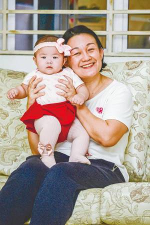 Liew and her child – PIC BY ADIB RAWI/THESUN
