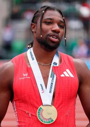 Gold medalist Noah Lyles reacts after winning the Xfinity Men’s 200m final during the 2025 USATF Outdoor Championships at Hayward Field on August 03, 2025 in Eugene, Oregon. - Christian Petersen/Getty Images/AFP