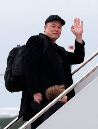 Elon Musk and his son X Æ A-12 board Air Force One at Joint Base Andrews in Maryland, U.S., March 14, 2025. REUTERSpix