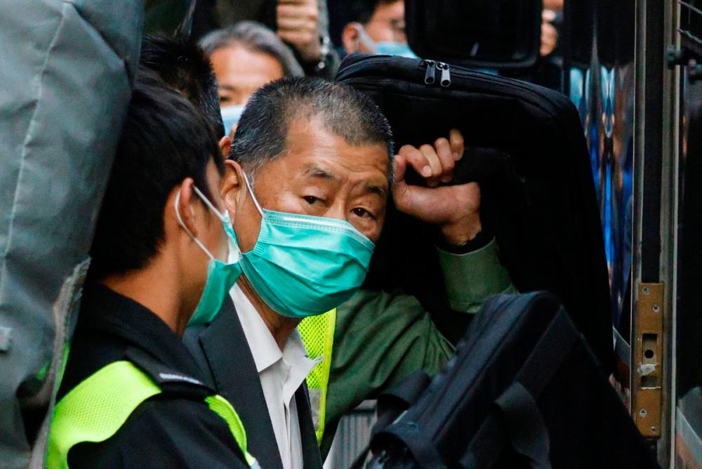 Media tycoon Jimmy Lai, founder of Apple Daily, looks on as he leaves the Court of Final Appeal by prison van, in Hong Kong, China February 1, 2021. REUTERSPIX