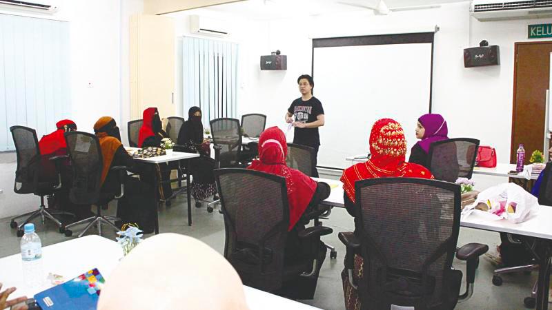 The women attending a programme to enable them to converse in Bahasa Malaysia. – PIC COURTESY OF mySDG Academy