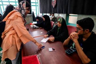 Polls open in Iran presidential election runoff