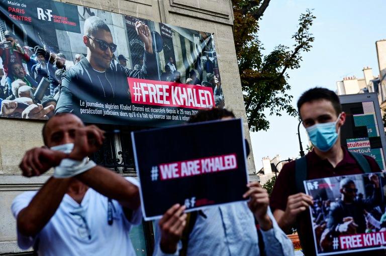 Protesters take part in an RSF-backed demonstration in support of jailed Algerian journalist Khaled Drareni on Sept 15 in Paris. — AFP