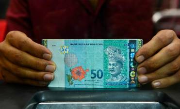 Ringgit opens easier as market anticipates softer US tariff stance
