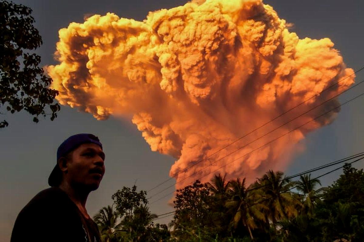 A villager watches the eruption of Mount Lewotobi Laki-Laki as seen from Talibura village in Sikka, East Nusa Tenggara, on June 17, 2025. (Photo by AFP)