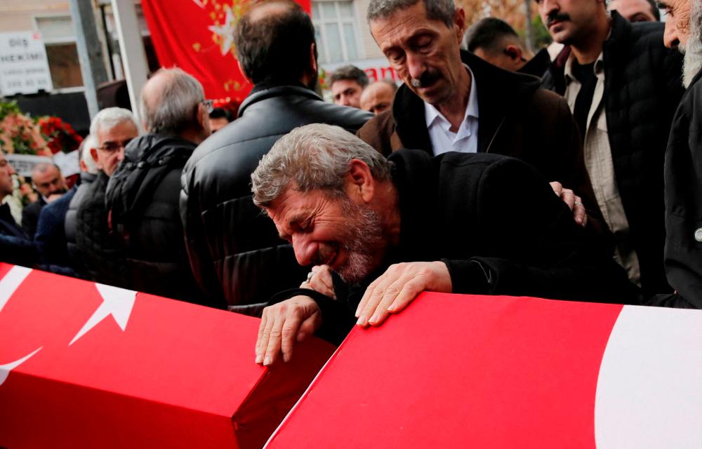 Abdi Koseoglu, father of Mukaddes Elif Topkara and father-in-law of Adem Topkara, two of the six victims of Sunday’s blast that took place on Istiklal Avenue, mourns during their funeral ceremony in Istanbul, Turkey, November 14, 2022. REUTERSPIX