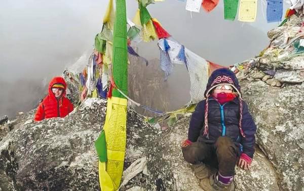 Zara (right) and Alex taking a break at the Mount Everest Base Camp. – PIC COURTESY OF DAVID SIFRA