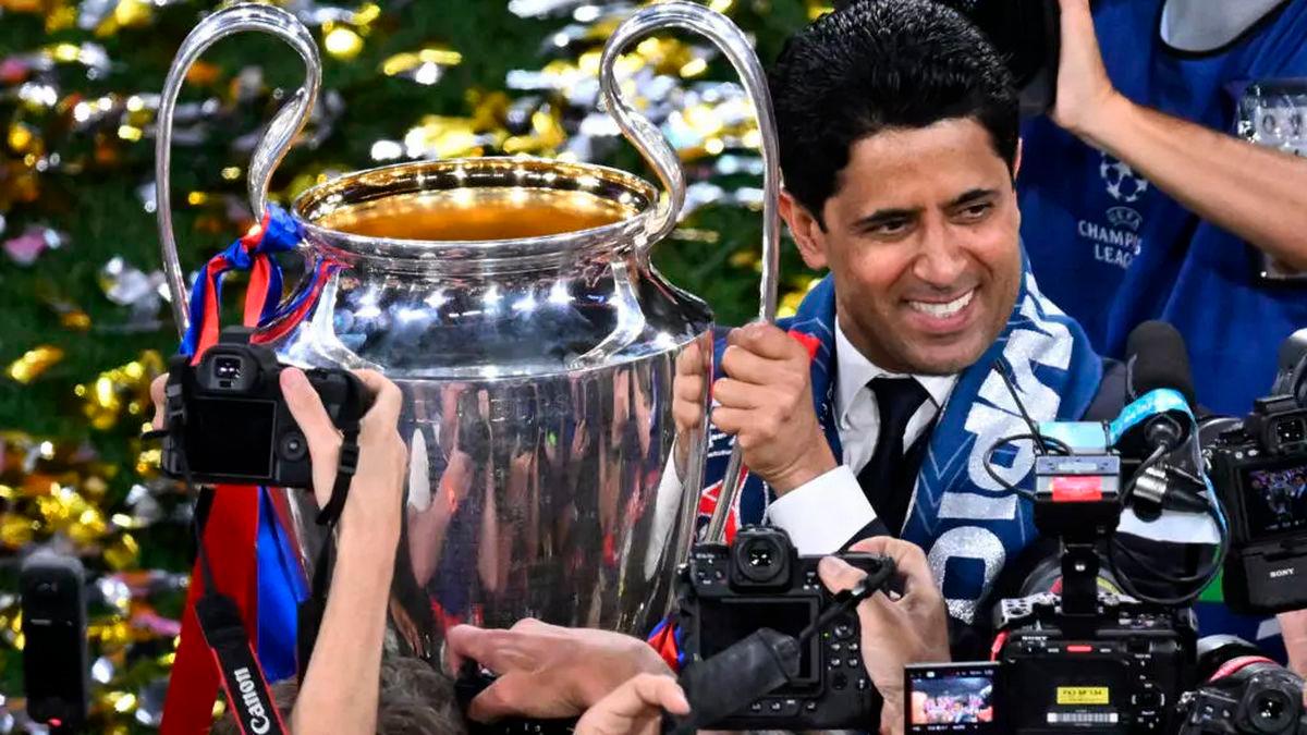 Paris Saint-Germain’s Qatari president Nasser al-Khelaifi with the Champions League trophy on Saturday © Kirill KUDRYAVTSEV / AFP