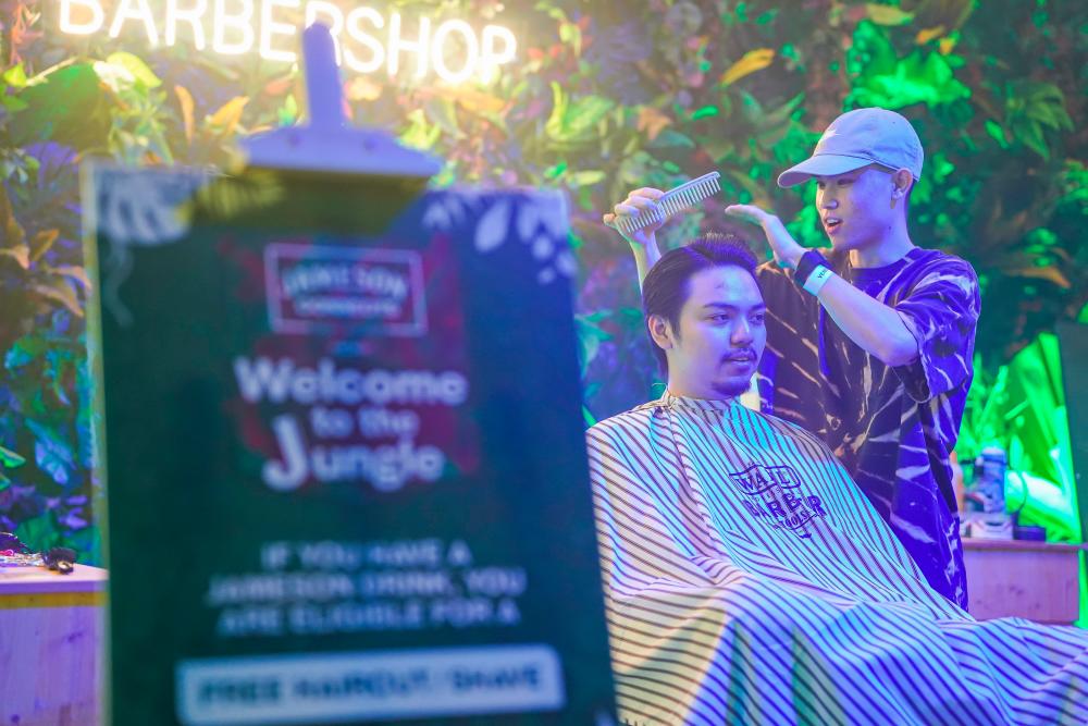 $!Customers enjoying a personalised grooming experience at the pop up barber shop.