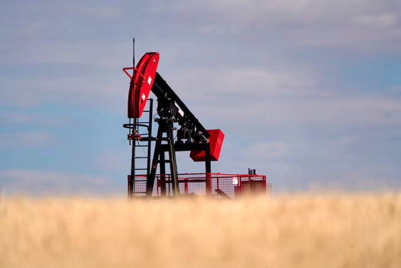 A view of an oil pumpjack in a farmer’s field near Kindersley, Saskatchewan, Canada - REUTERSpix