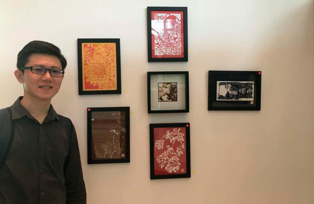 Chong with his artworks during an exhibition at Bank Negara Malaysia. – COURTESY OF CHONG KAI ZEN