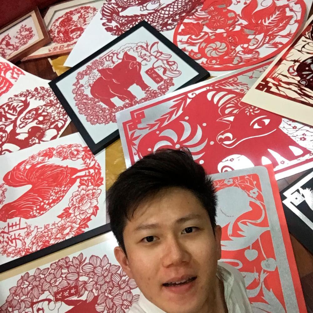 $!Chong with his Chinese Zodiac animal paper-cutting artworks. – COURTESY OF CHONG KAI ZEN