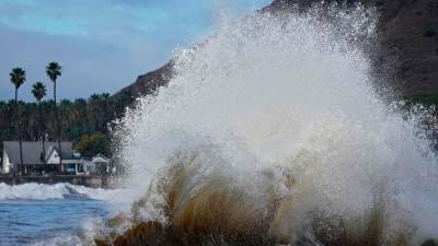Massive waves on California coast cause flooding, force evacuations