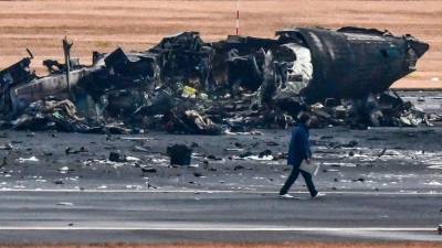 Japan probes plane inferno after ‘miracle’ escape