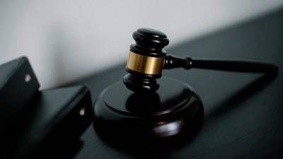 Director faces 10 counts of failing to report bribes involving Penjana claims