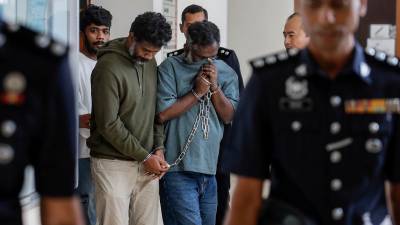 Three charged with smuggling Sri Lankan national via KLIA